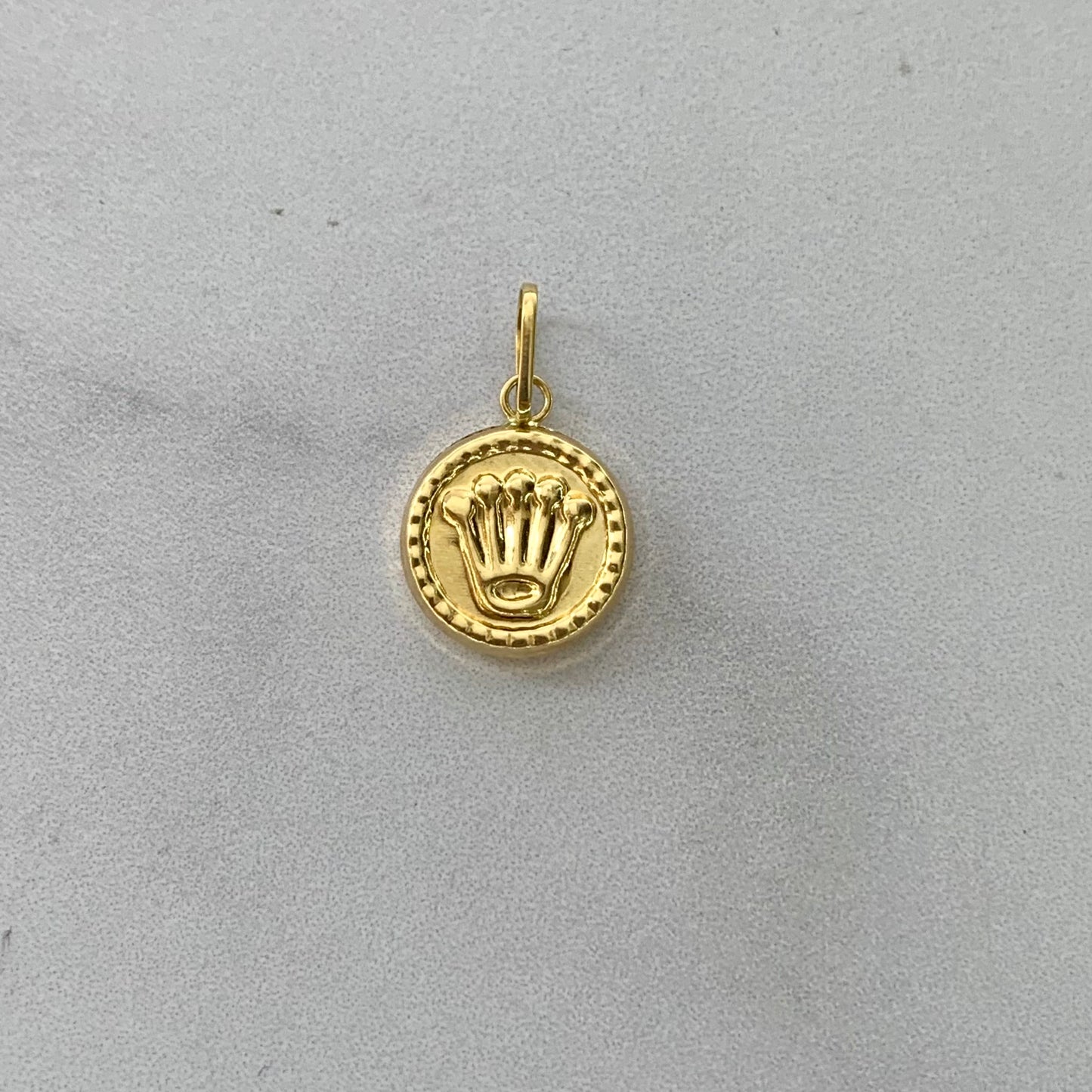 Dije Rx Troquelado 0.6Gr / 20Mm Oro Amarillo L720 18K
